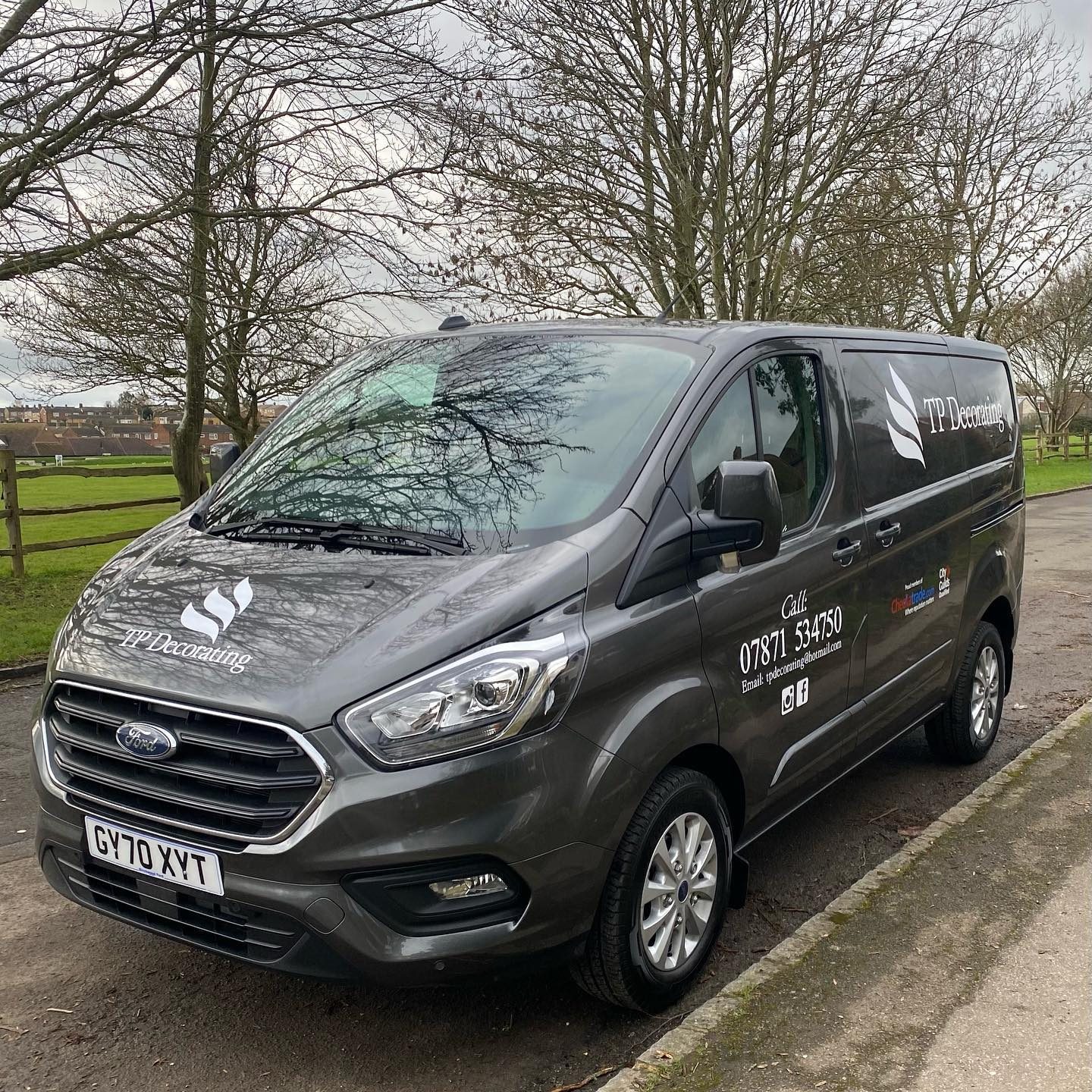 The TP Decorating van, a grey Ford Transit Custom with the TP Decorating logo